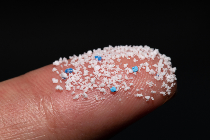 Small Plastic pellets on the finger.Micro plastic.air pollution