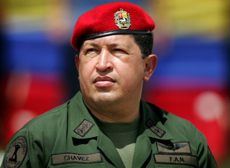 Venezuela's President Hugo Chavez wears an army uniform and the red beret of his parachute regiment while attending a military parade in Caracas in this April 13, 2005 file photo.  Chavez has died after a two-year battle with cancer, ending the socialist leader's 14-year rule of the South American country, Vice President Nicolas Maduro said in a televised speech on March 5, 2013. REUTERS/Jorge Silva/Files (VENEZUELA - Tags: POLITICS OBITUARY TPX IMAGES OF THE DAY)